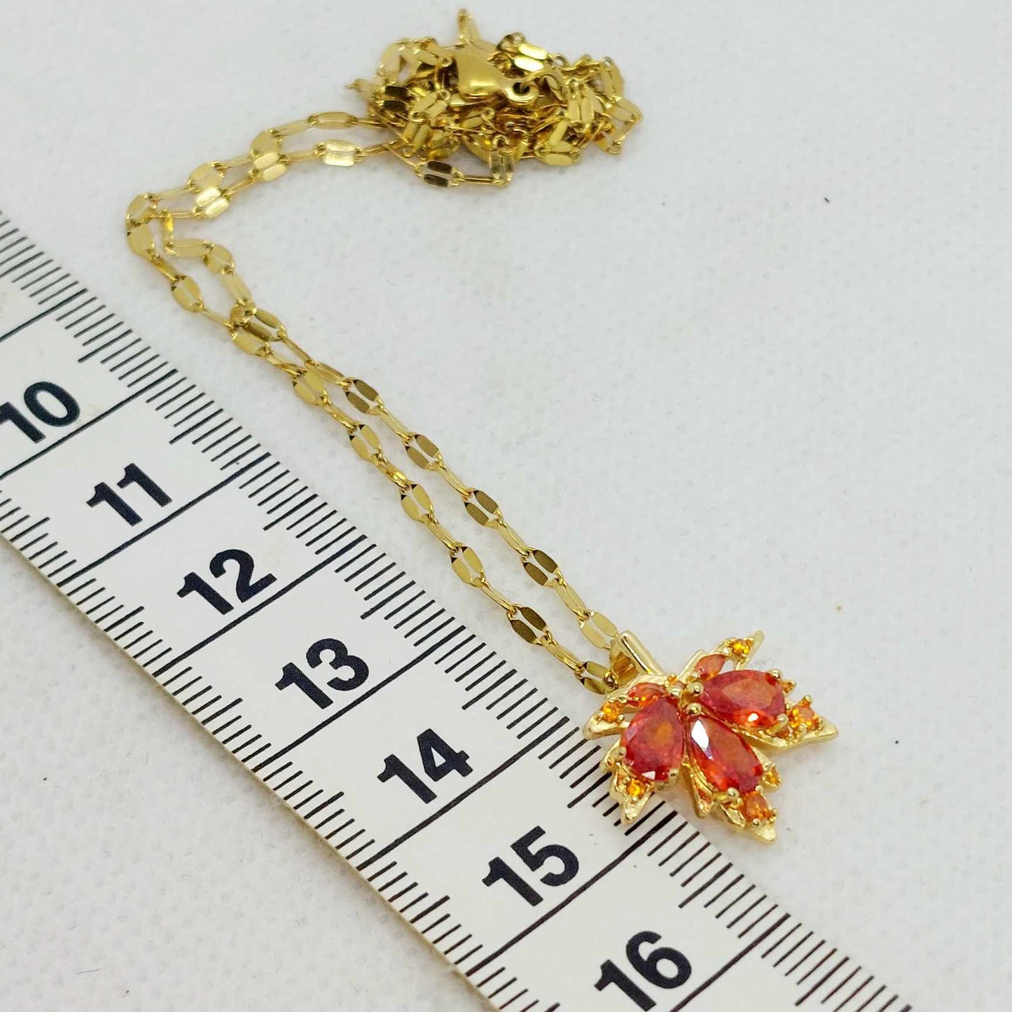 Maple Leaf Pendant in Red Zircon and Stainless Steel with Gold Plated Necklace Chain