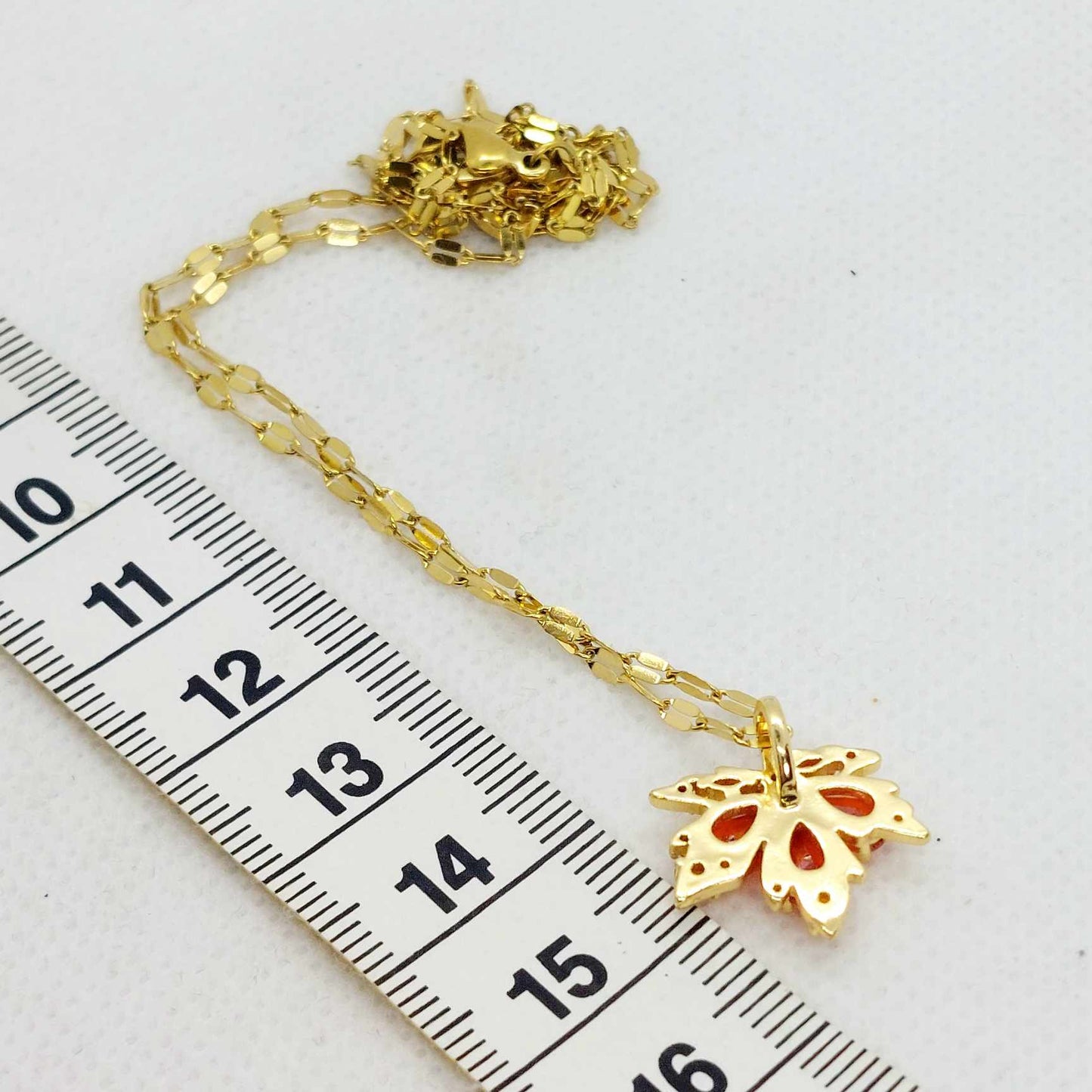 Maple Leaf Pendant in Red Zircon and Stainless Steel with Gold Plated Necklace Chain