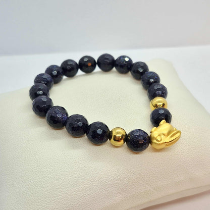 Blue Faceted Goldstone Bracelet in 10mm Stones with Silver Bunny Bead